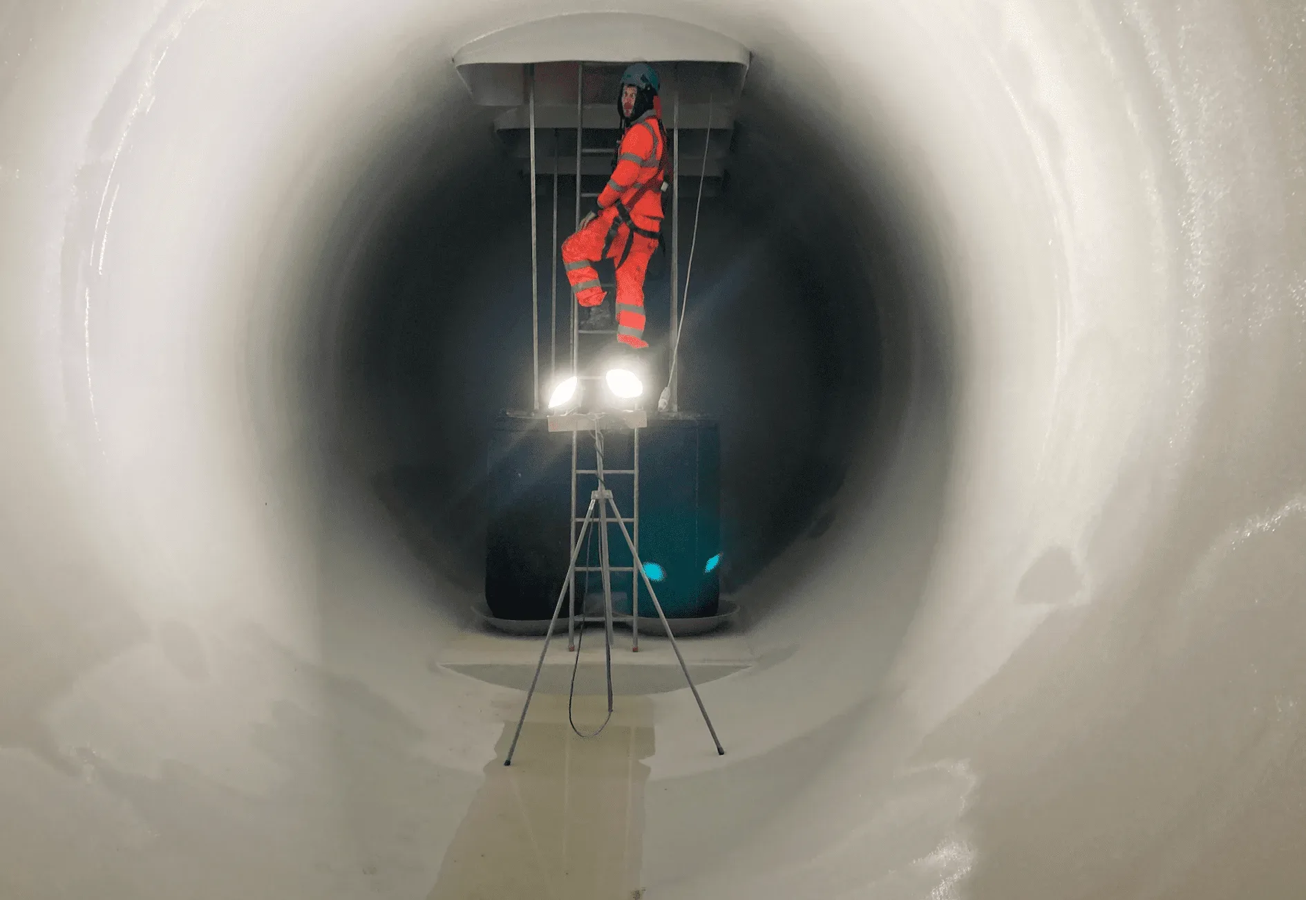 UCL applicator applying a protective coating inside a large GRP wastewater tank