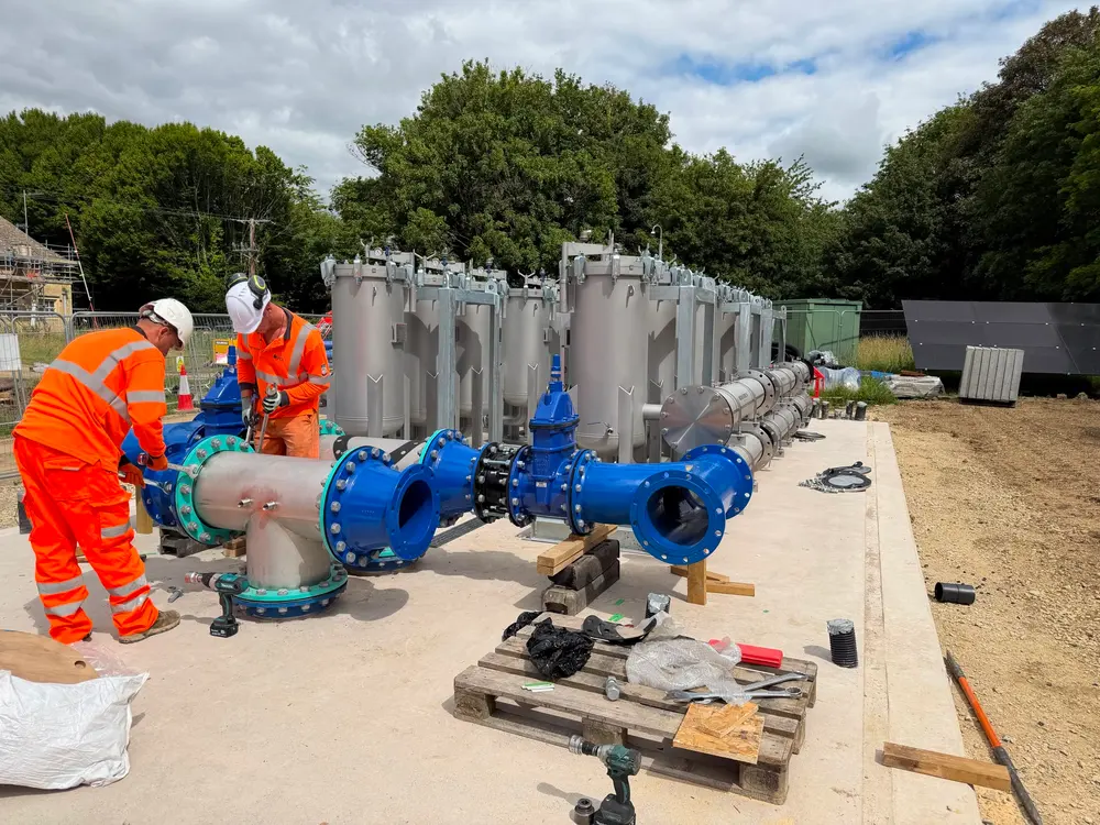 UCL engineers installing valves and pipework at a water treatment site